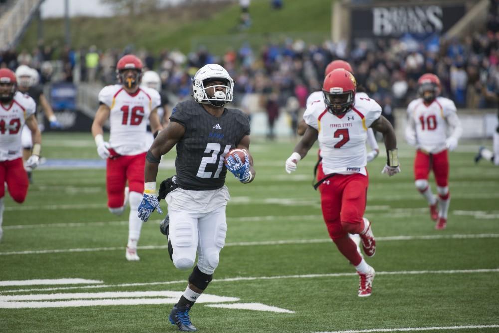 GVL / Luke Holmes - Marty Carter (21) runs in the touchdown. GVSU lost to Ferris State in Lubbers Stadium on Saturday, Dec. 3, 2016.