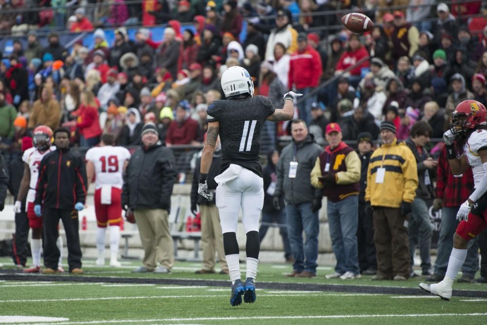 GVL / Luke Holmes - Nick Dodson (11) nonchalantly tosses the ball to the sideline after making the play. GVSU lost to Ferris State in Lubbers Stadium on Saturday, Dec. 3, 2016.