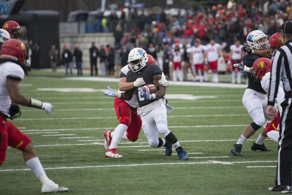 GVL / Luke Holmes - Marty Carter (21) gets tackled. GVSU lost to Ferris State in Lubbers Stadium on Saturday, Dec. 3, 2016.