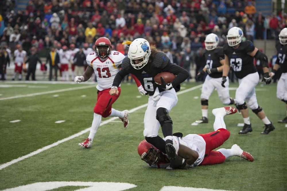 GVL / Luke Holmes - Bart Williams (6) craftfully avoids the tackle. GVSU lost to Ferris State in Lubbers Stadium on Saturday, Dec. 3, 2016.