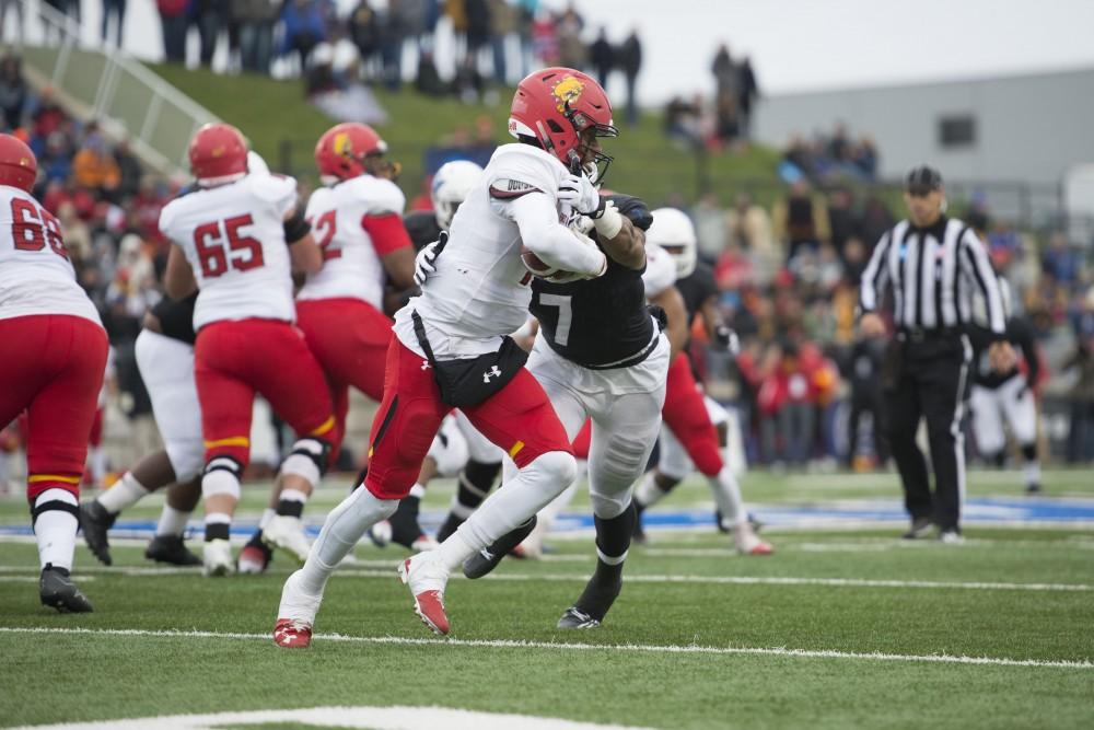 GVL / Luke Holmes - David Talley (7) attempts to make the tackle. GVSU lost to Ferris State in Lubbers Stadium on Saturday, Dec. 3, 2016.