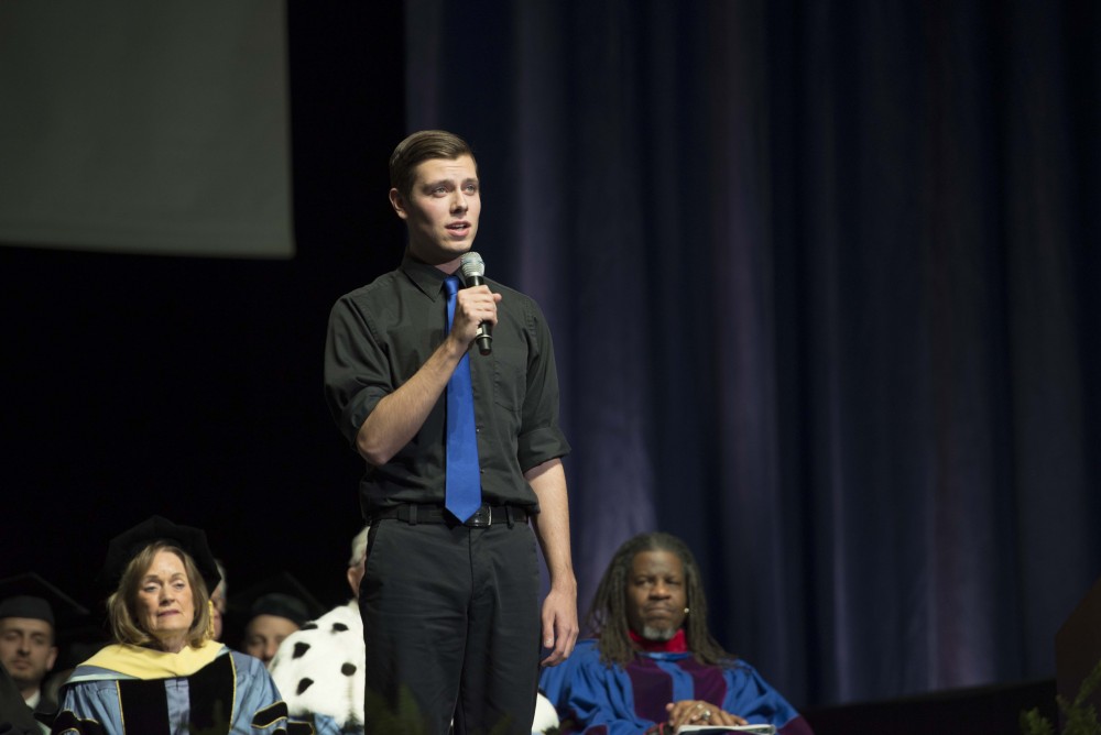 GVL / Luke Holmes - Casey Huls sings a song. GVSU commencement was held in Van Andel Arena on Saturday, Dec. 10, 2016.