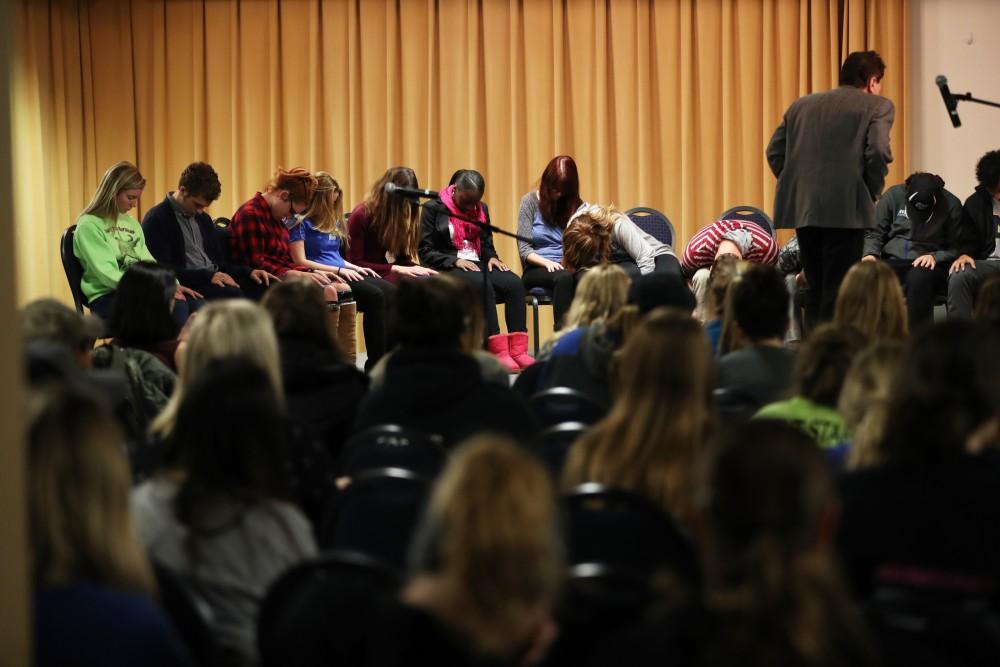 GVL/Kevin Sielaff - Hypnotist Tom Deluca puts audience members to sleep inside the Kirkhof Center's Grand River Room on Wednesday, Nov. 30, 2016. 