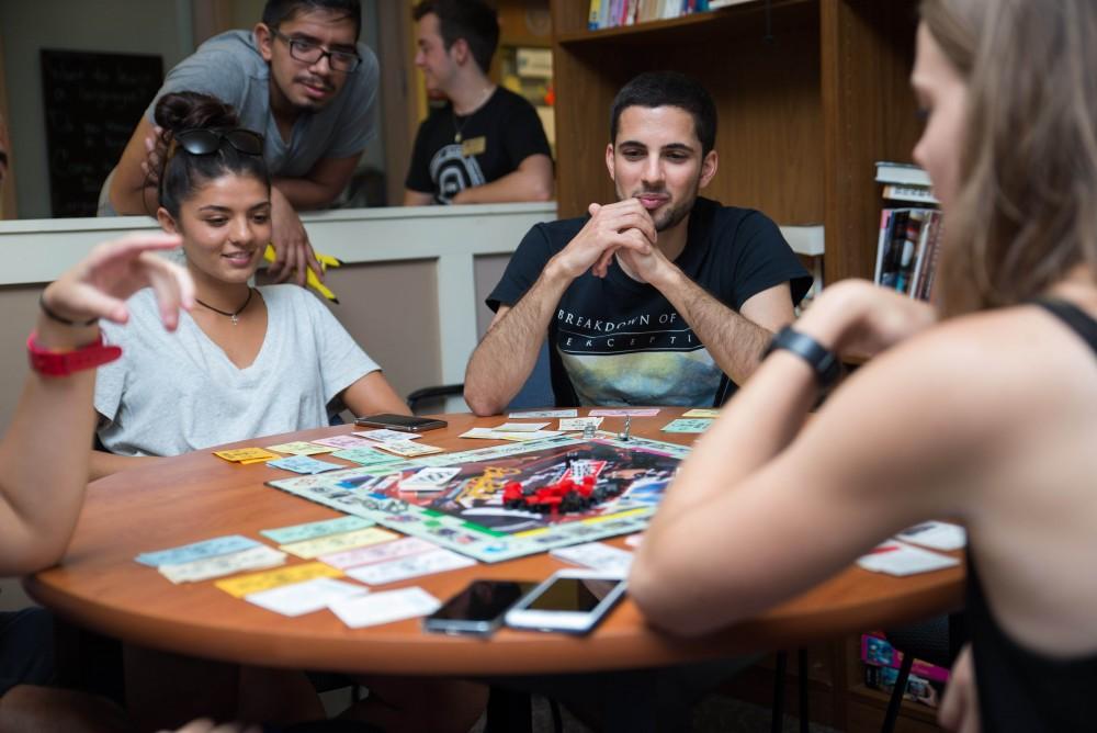 GVL / Luke Holmes - International students play Monopoly in the Murray International House.
