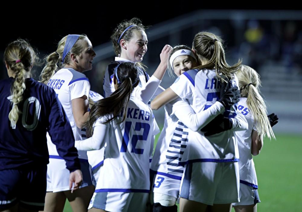 GVL / Emily Frye 
The Grand Valley State Lakers celebrate after the first goal of the semi finals scored by Marti Corby during the first half of the game on Thursday Dec. 1, 2016. 