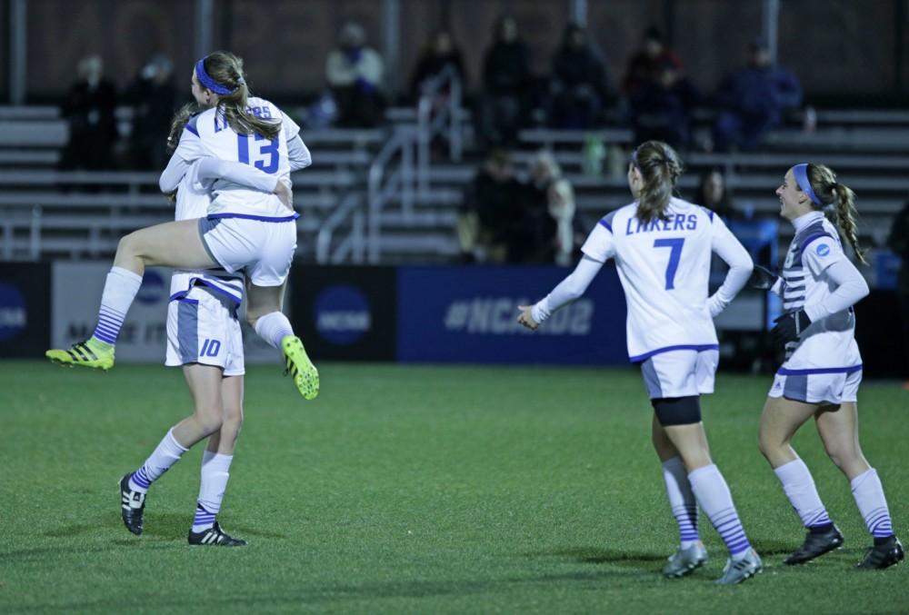 GVL / Emily Frye 
The Grand Valley State Lakers celebrate after the second goal of the semi finals scored by Marti Corby during the first half of the game on Thursday Dec. 1, 2016. 