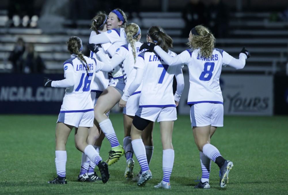 GVL / Emily Frye 
The Grand Valley State Lakers celebrate after the second goal of the semi finals scored by Marti Corby during the first half of the game on Thursday Dec. 1, 2016. 