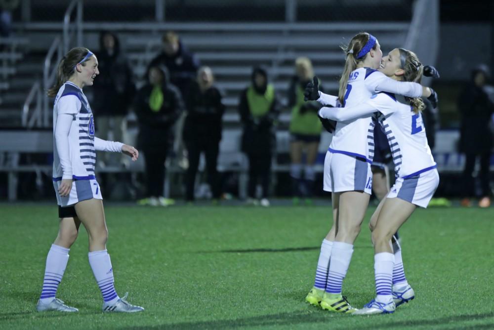 GVL / Emily Frye 
The Grand Valley State Lakers celebrate after the second goal of the semi finals scored by Marti Corby during the first half of the game on Thursday Dec. 1, 2016. 