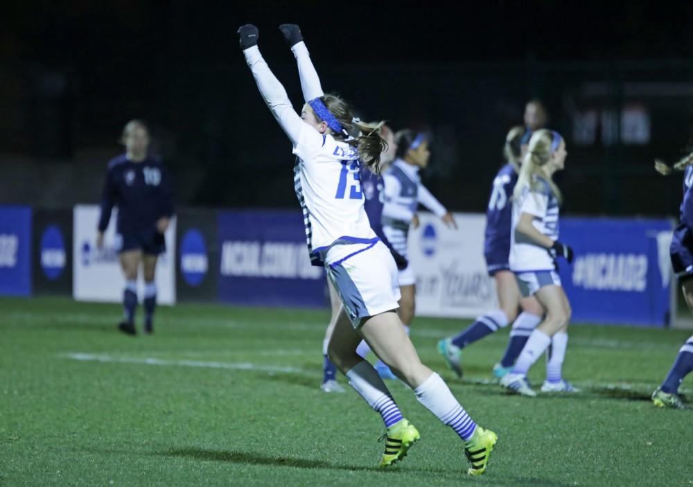 GVL / Emily Frye 
The Grand Valley State Lakers celebrate after the second goal of the semi finals scored by Marti Corby during the first half of the game on Thursday Dec. 1, 2016. 