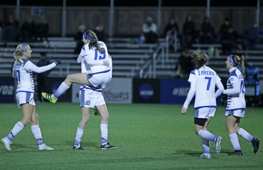 GVL / Emily Frye 
The Grand Valley State Lakers celebrate after the second goal of the semi finals scored by Marti Corby during the first half of the game on Thursday Dec. 1, 2016. 