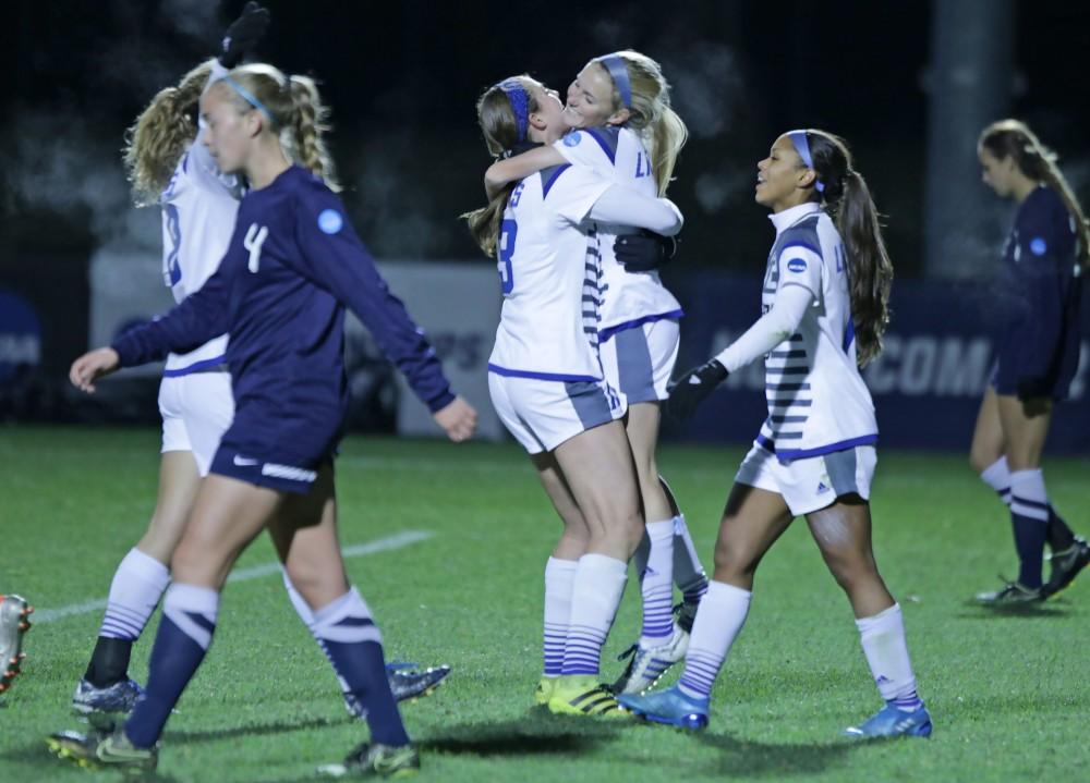 GVL / Emily Frye The Grand Valley State Lakers celebrate after the third goal of the semi finals scored by Kendra Stauffer during the first half of the game on Thursday Dec. 1, 2016. 