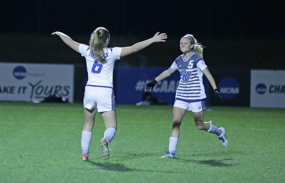 GVL / Emily Frye 
The Grand Valley State Lakers celebrate after the third goal of the semi finals scored by Kendra Stauffer during the first half of the game on Thursday Dec. 1, 2016. 