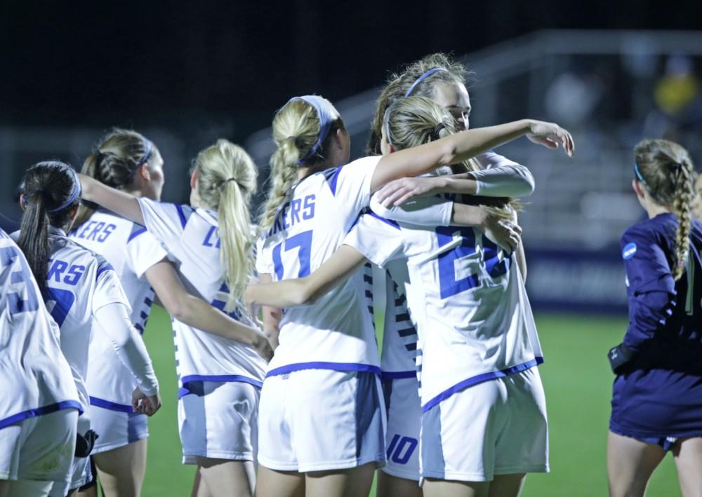 GVL / Emily Frye
The Grand Valley State Lakers celebrate the first goal of the game against Colombus State in the semi final round on Thursday Dec. 1, 2016. 