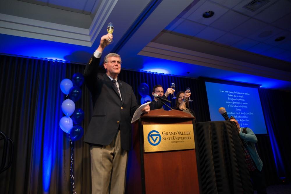 GVL / Luke Holmes - Students celebrate a "Toast with T. Haas" in the Eberhard Center on Thursday, Dec. 8, 2016.