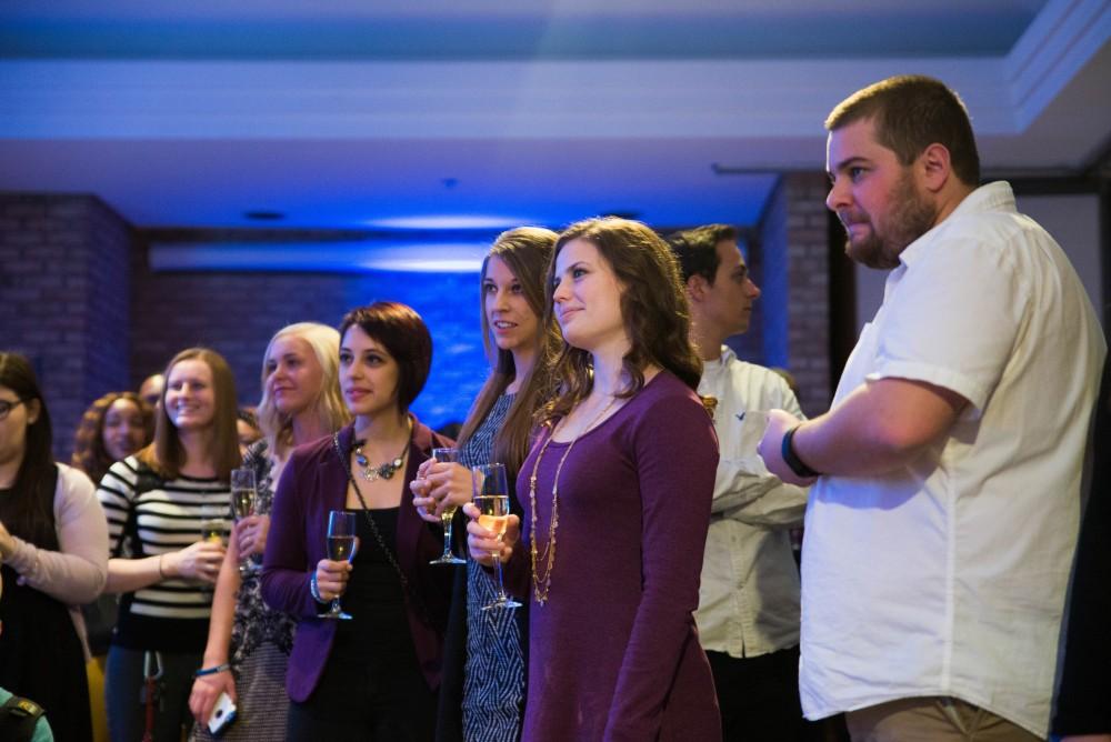 GVL / Luke Holmes - Students celebrate a "Toast with T. Haas" in the Eberhard Center on Thursday, Dec. 8, 2016.