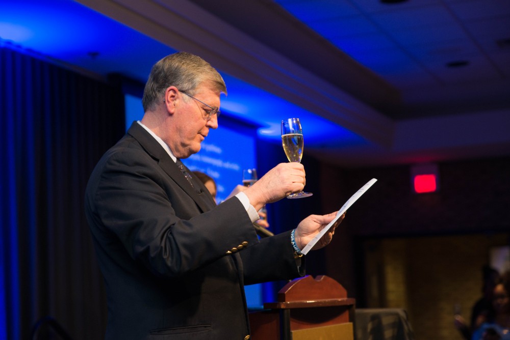 GVL / Luke Holmes - Students celebrate a "Toast with T. Haas" in the Eberhard Center on Thursday, Dec. 8, 2016.