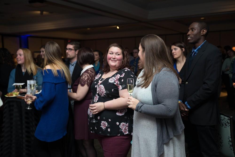 GVL / Luke Holmes - Students celebrate a "Toast with T. Haas" in the Eberhard Center on Thursday, Dec. 8, 2016.