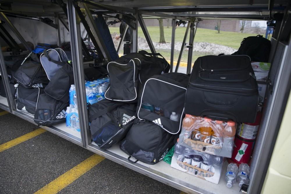 GVL / Luke Holmes - The basketball teams load the bus and set off for up north.