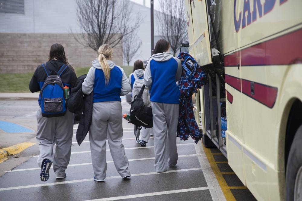 GVL / Luke Holmes - The basketball teams load the bus and set off for up north.