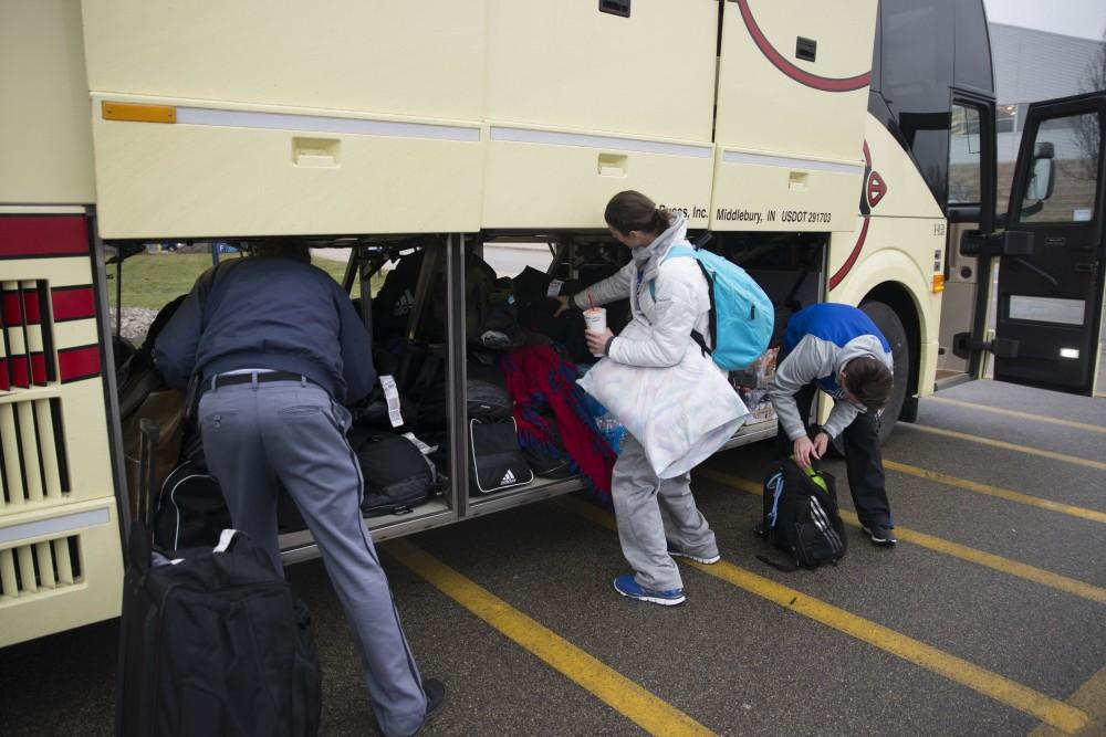 GVL / Luke Holmes - The basketball teams load the bus and set off for up north.