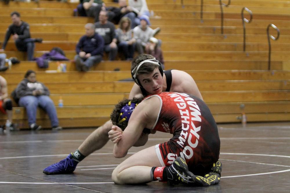 GVL / ArchiveTrenton Hunt holds his opponent during the club wrestling match on Saturday Feb. 6, 2016 in Allendale, MI.