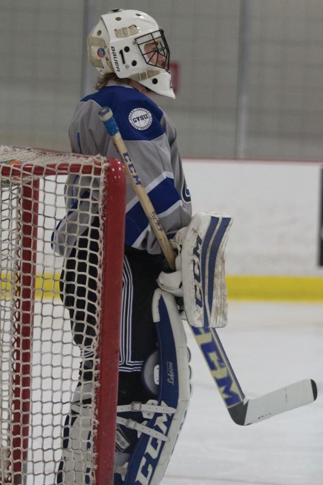 GVL/Mackenzie Bush - Jack Lindsay (1) watches the play closely. GVSU Men’s D3 Hockey plays Michigan State University Saturday, Dec. 10, 2016. 