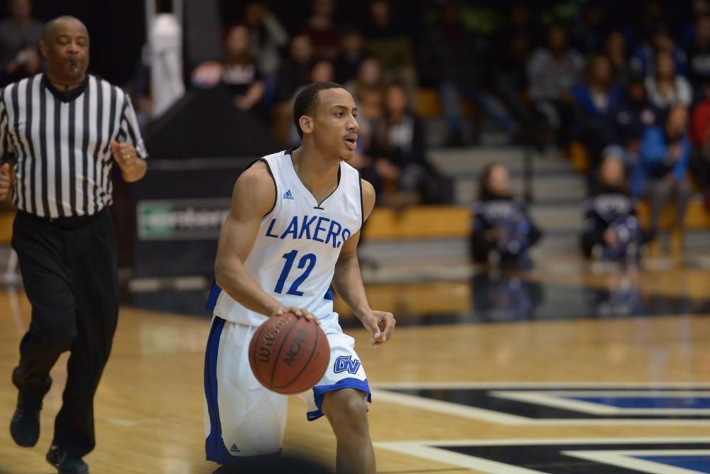 GVL / Luke Holmes - Myles Miller (12) dribbles the ball down the court. GVSU men’s basketball defeated Wayne State University on Thursday, Jan.19, 2017.