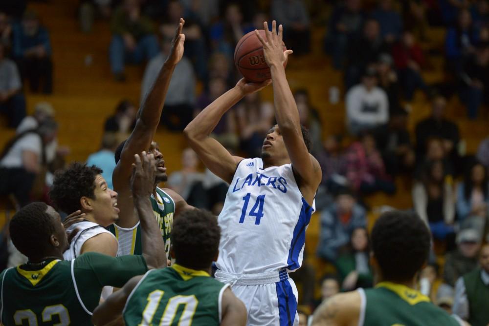 GVL / Luke Holmes - Chris Dorsey (14) goes up for the shot. GVSU men’s basketball defeated Wayne State University on Thursday, Jan.19, 2017.