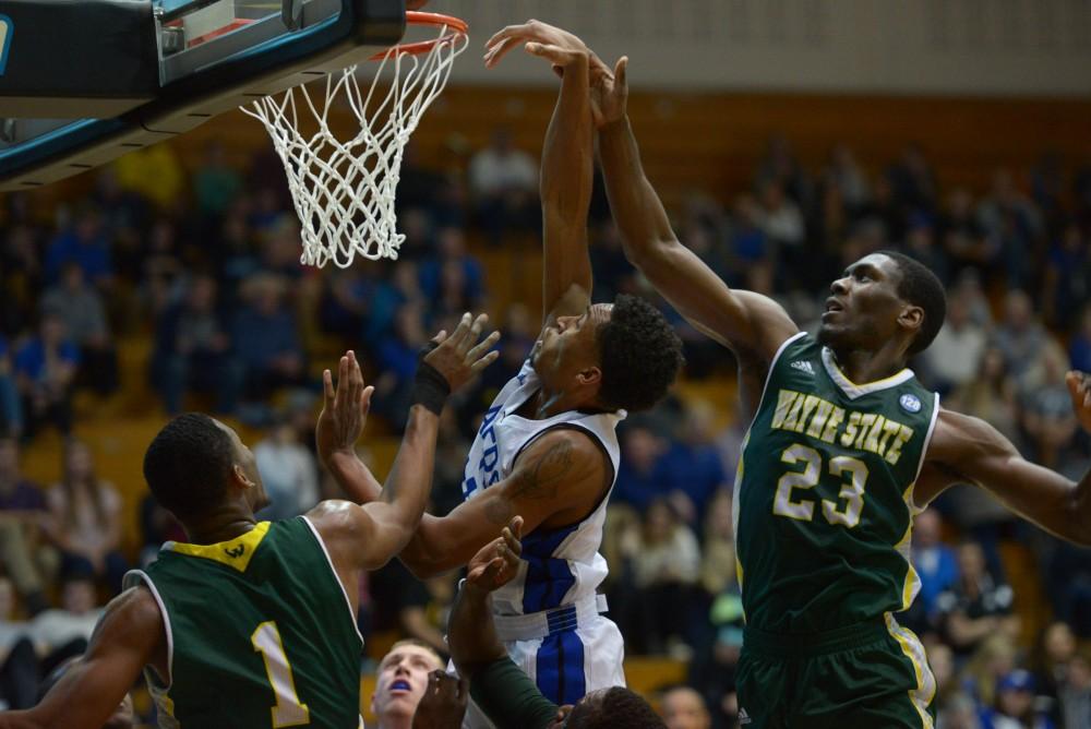 GVL / Luke Holmes - Chris Dorsey (14) attempts to score the basket. GVSU men’s basketball defeated Wayne State University on Thursday, Jan.19, 2017.