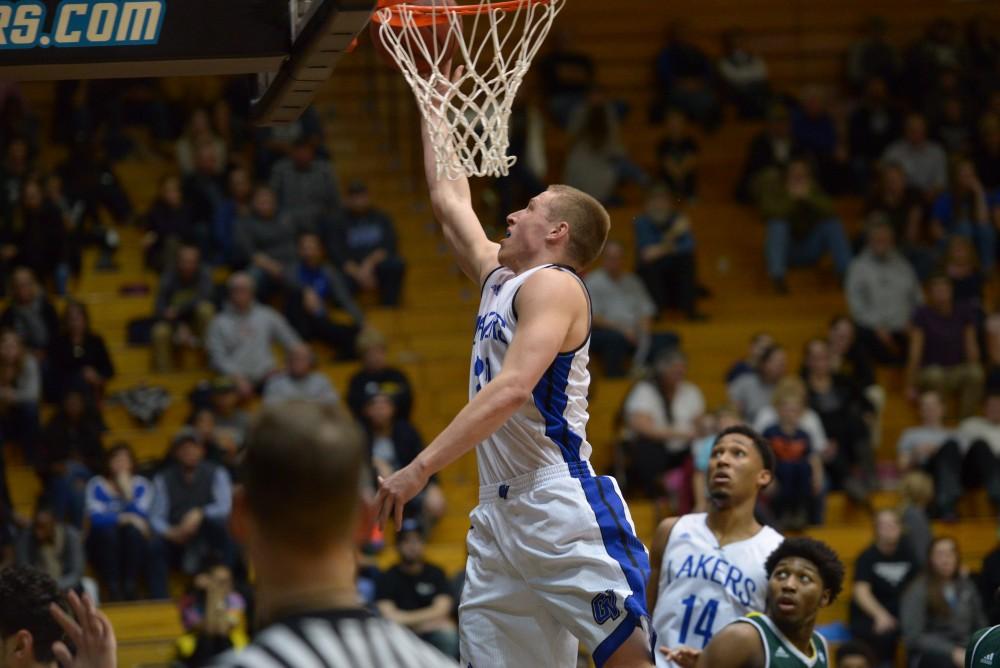 GVL / Luke Holmes - Luke Ryskamp (23) goes up for the layup. GVSU men’s basketball defeated Wayne State University on Thursday, Jan.19, 2017.