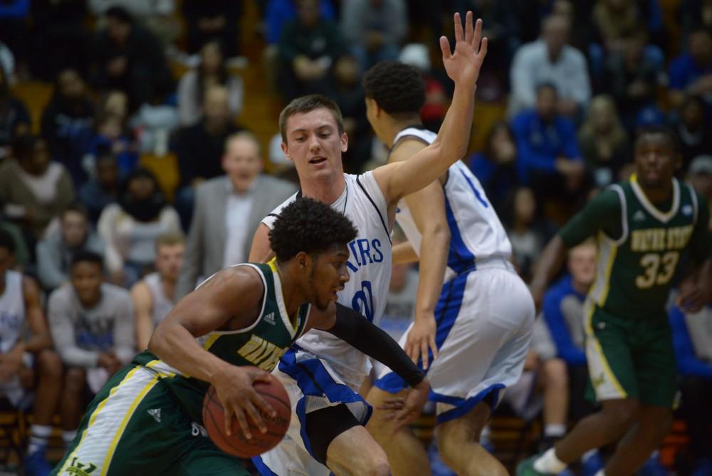 GVL / Luke Holmes - Alec Marty (20) plays defense. GVSU men’s basketball defeated Wayne State University on Thursday, Jan.19, 2017.