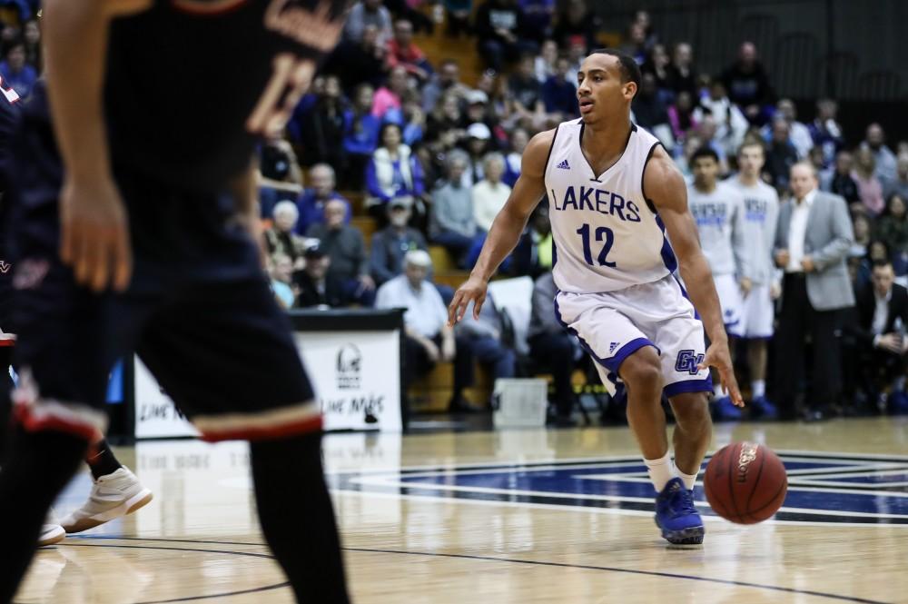 GVL/Kevin Sielaff - Myles Miller (12) looks to pass during the game inside the Fieldhouse Arena as Grand Valley squares off against SVSU on Saturday, Jan. 21, 2017. The Lakers took the victory with a final score of 80-71.