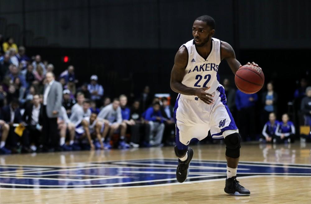 GVL/Kevin Sielaff - Juwan Starks (22) controls the ball at the top of the arc during the game inside the Fieldhouse Arena as Grand Valley squares off against SVSU on Saturday, Jan. 21, 2017. The Lakers took the victory with a final score of 80-71.