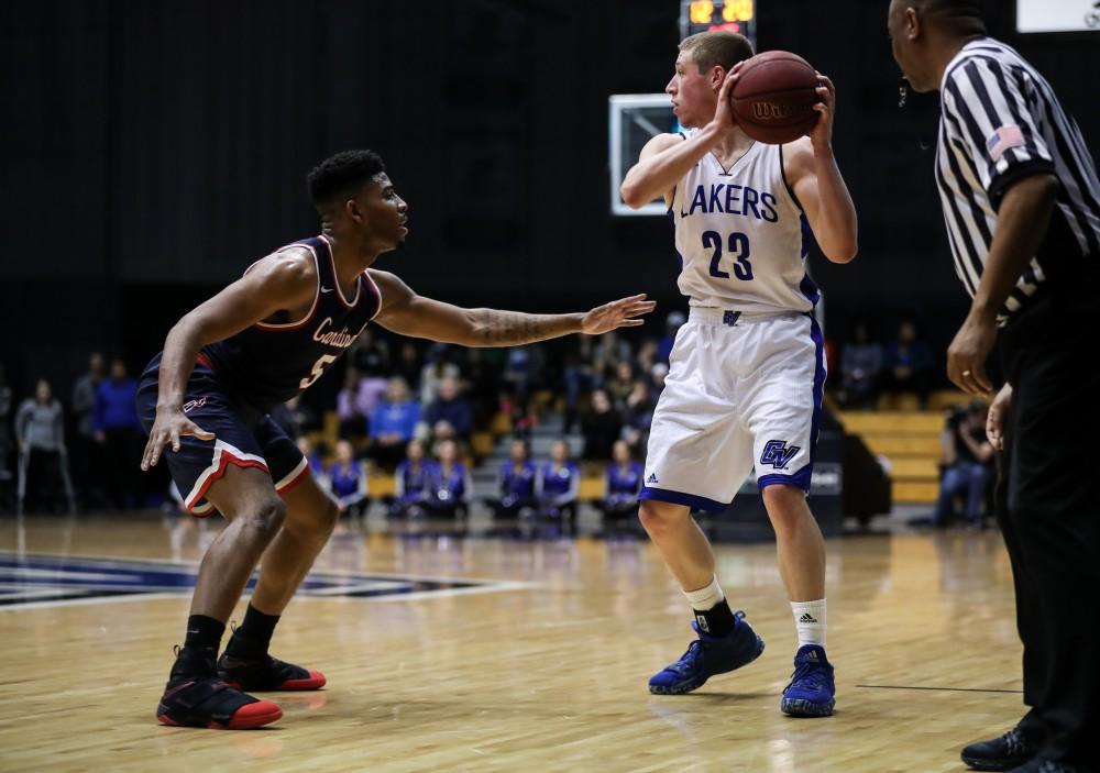 GVL/Kevin Sielaff - Luke Ryskamp (23), defended closely, looks to set up a play during the game inside the Fieldhouse Arena as Grand Valley squares off against SVSU on Saturday, Jan. 21, 2017. The Lakers took the victory with a final score of 80-71.