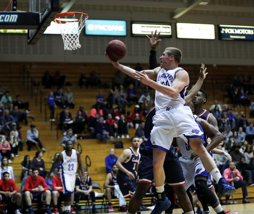 GVL/Kevin Sielaff - Luke Ryskamp (23), in traffic, goes in for a lay-up and converts during the game inside the Fieldhouse Arena as Grand Valley squares off against SVSU on Saturday, Jan. 21, 2017. The Lakers took the victory with a final score of 80-71.