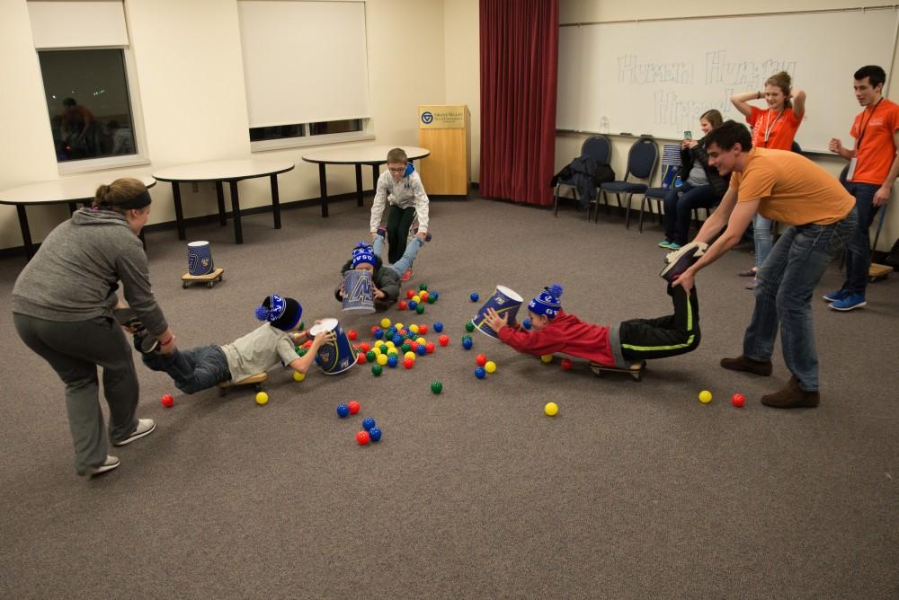 GVL/Luke HolmesKids play a lifesize version of “Hungry Hippo” in the Kirkhof Center for Sibs and Kids Weekend Friday, Jan. 29, 2016.