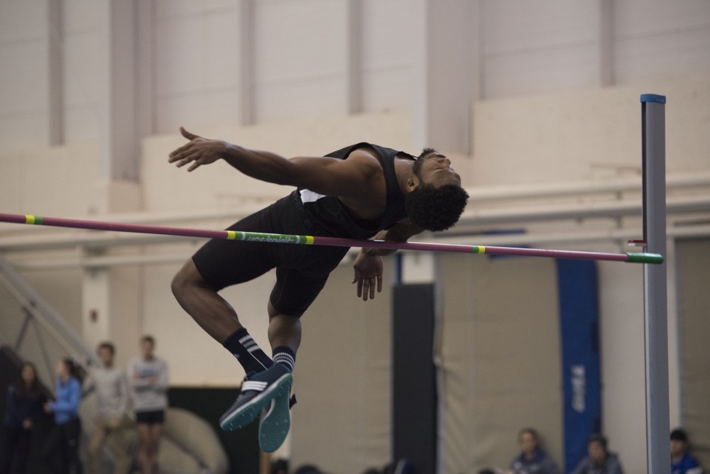 GVL / Luke Holmes - Brandon Bean jumps over the pole. The GVSU Lints Alumni Meet was held in the Kelly Family Sports Center on Saturday, Jan. 29, 2016.