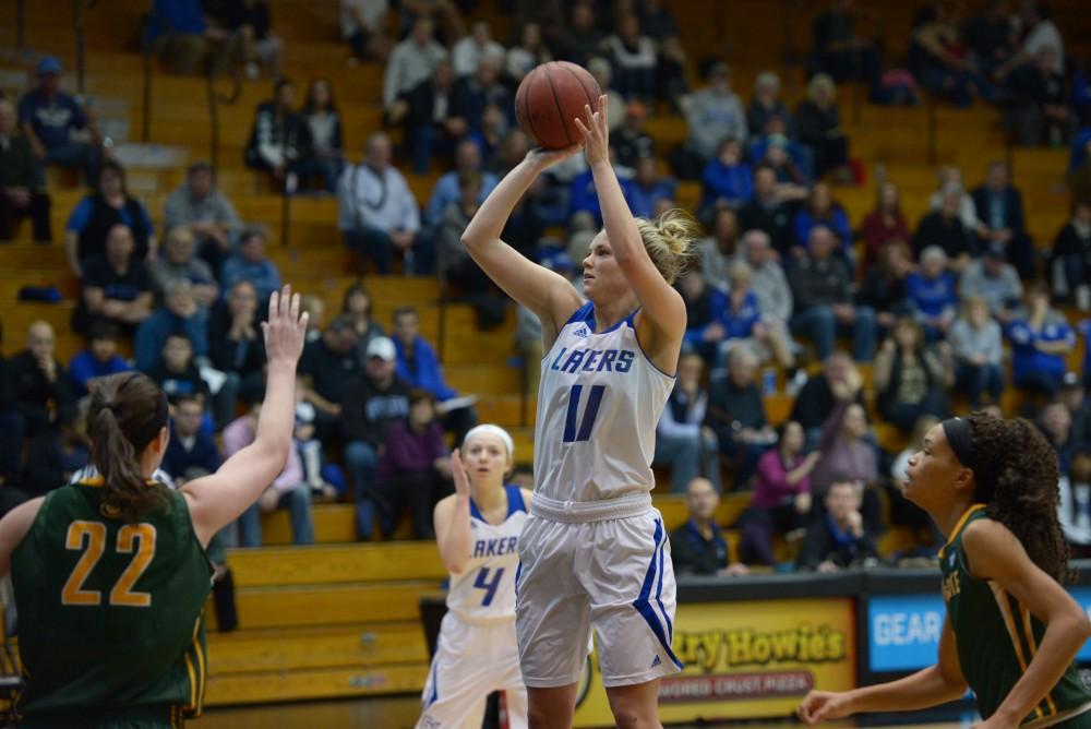 GVL / Luke Holmes - Piper Tucker (11) goes up for the shot. GVSU Women’s Basketball defeated Wayne State University on Thursday, Jan.19, 2017.