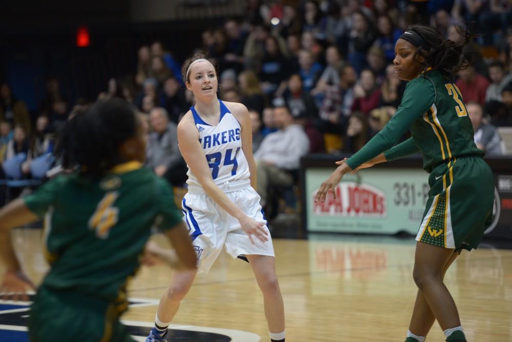 GVL / Luke Holmes - Bailey Cairnduff (34) makes the pass. GVSU Women’s Basketball defeated Wayne State University on Thursday, Jan.19, 2017.