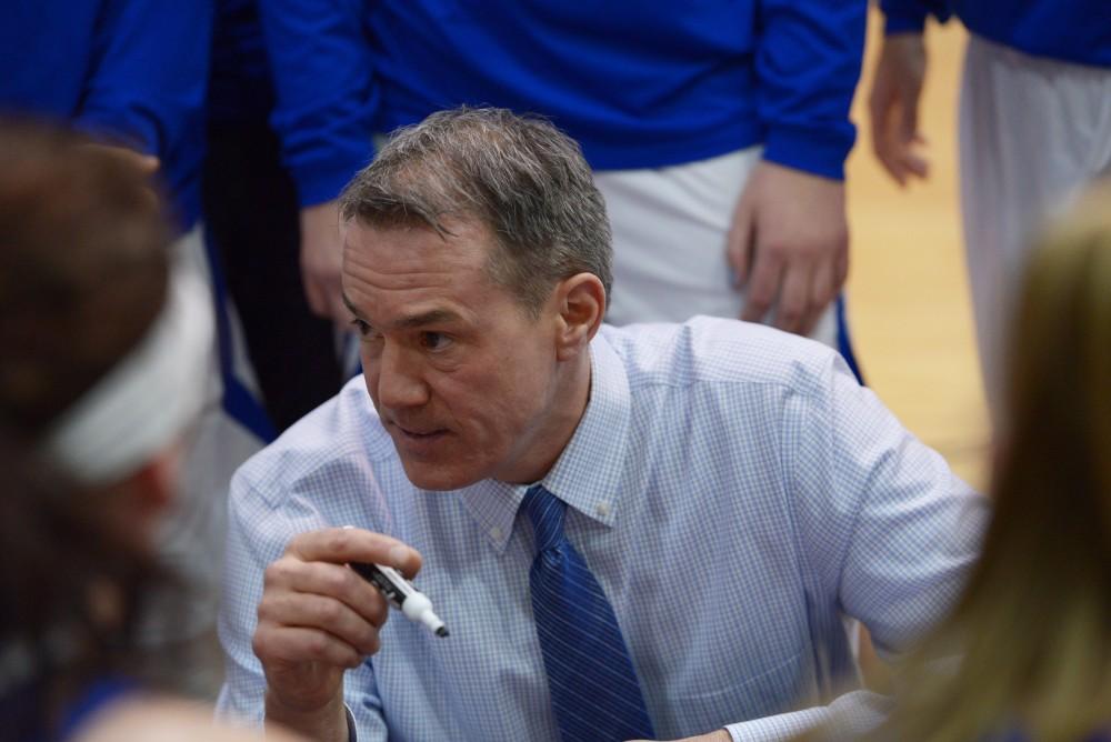 GVL / Luke Holmes - Mike Williams talks to girls at the timeout. GVSU Women’s Basketball defeated Wayne State University on Thursday, Jan.19, 2017.