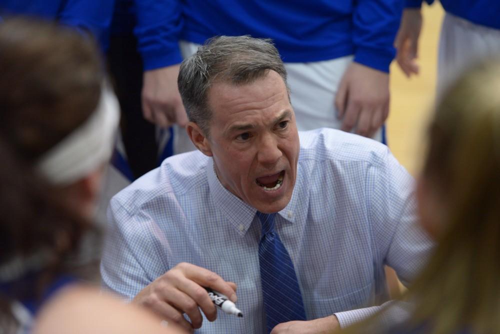 GVL / Luke Holmes - Mike Williams talks to the girls at the timeout. GVSU Women’s Basketball defeated Wayne State University on Thursday, Jan.19, 2017.