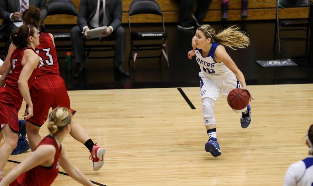 GVL/Kevin Sielaff - Taylor Lutz (10) drives the ball around the top of the arc during the game inside the Fieldhouse Arena as Grand Valley squares off against SVSU on Saturday, Jan. 21, 2017. The Lakers took the victory with a final score of 63-57.