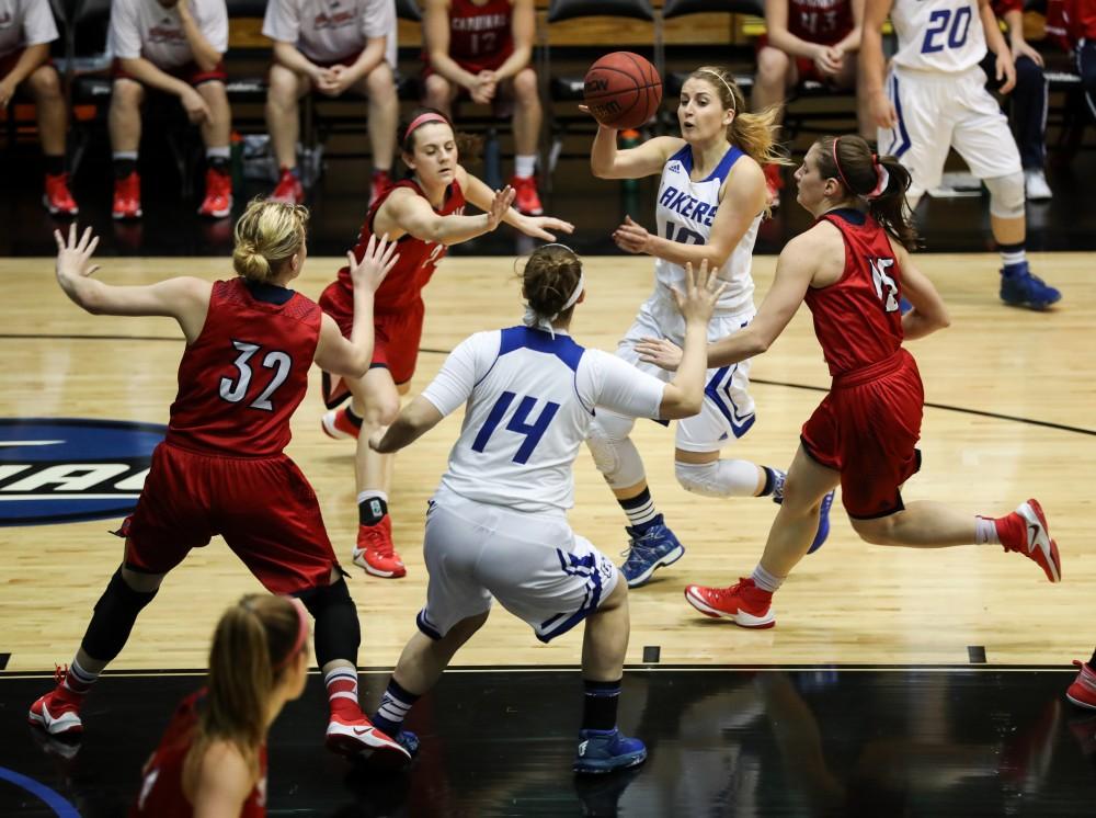 GVL/Kevin Sielaff - Taylor Lutz (10), in traffic, passes the ball off to Taylor Parmley (14) during the game inside the Fieldhouse Arena as Grand Valley squares off against SVSU on Saturday, Jan. 21, 2017. The Lakers took the victory with a final score of 63-57.