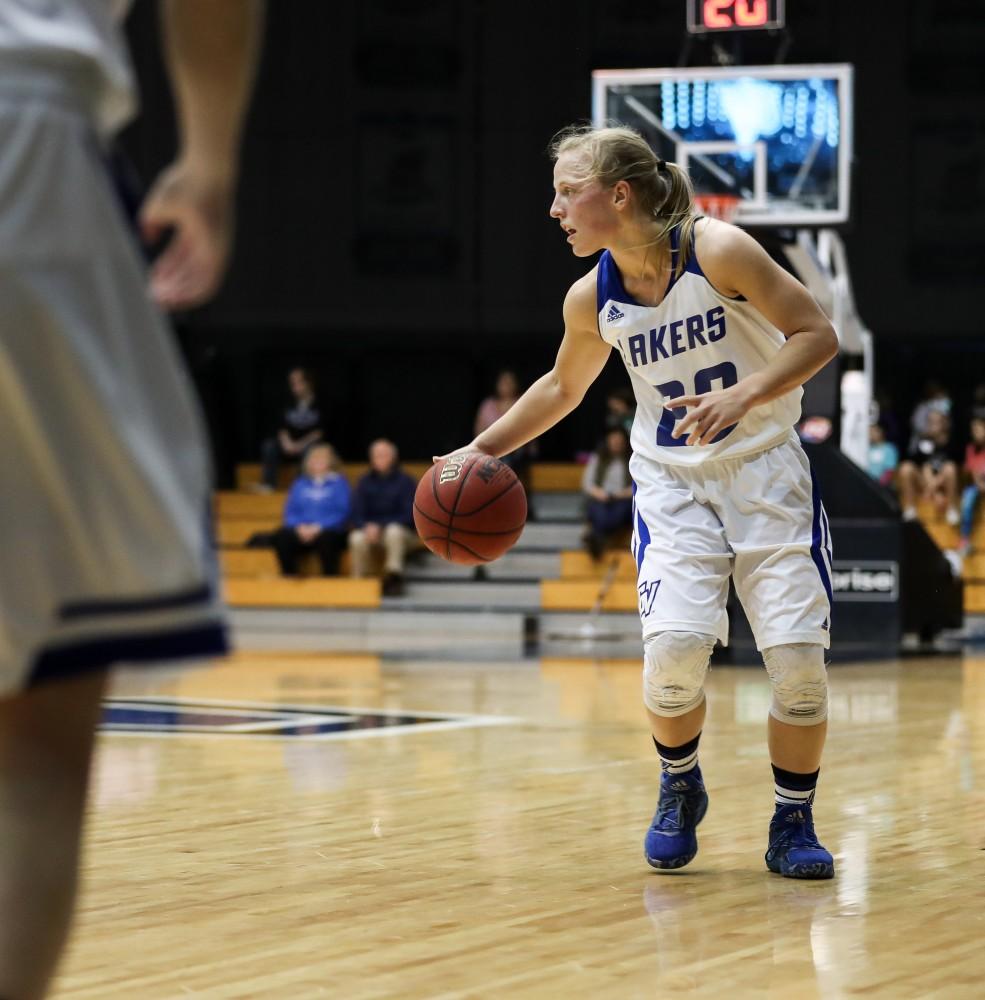 GVL/Kevin Sielaff - Janae Langs (20) dribbles the ball at the top of the arc during the game inside the Fieldhouse Arena as Grand Valley squares off against SVSU on Saturday, Jan. 21, 2017. The Lakers took the victory with a final score of 63-57.