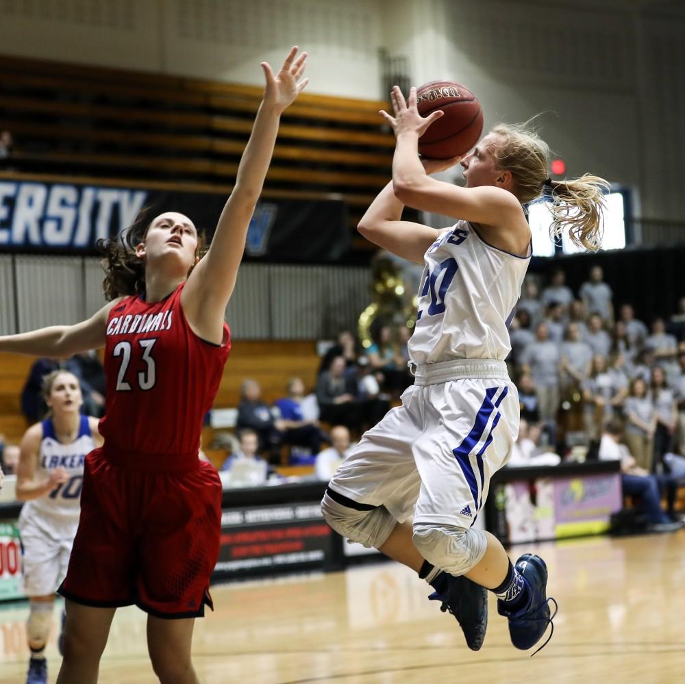 GVL/Kevin Sielaff - Janae Langs (20) jumps up and over Saginaw's Hannah Settingsgaard (23) as she takes a mid-range jumper during the game inside the Fieldhouse Arena as Grand Valley squares off against SVSU on Saturday, Jan. 21, 2017. The Lakers took the victory with a final score of 63-57.