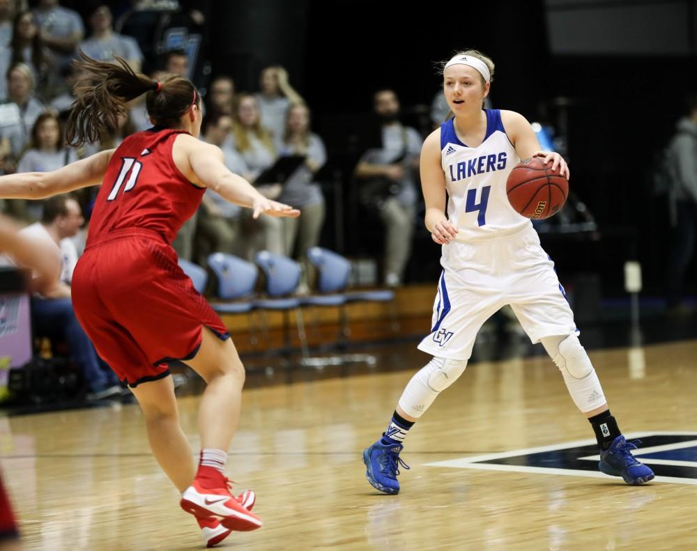 GVL/Kevin Sielaff - Jenn DeBoer (4) jukes out Saginaw's Katelyn Carriere (15) and drives to the hoop during the game inside the Fieldhouse Arena as Grand Valley squares off against SVSU on Saturday, Jan. 21, 2017. The Lakers took the victory with a final score of 63-57.