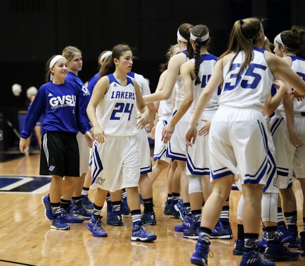 GVL/Kevin Sielaff - Kyleigh Kubik (24) shakes hands with her fellow teammates after a Laker victory after the game inside the Fieldhouse Arena as Grand Valley squares off against SVSU on Saturday, Jan. 21, 2017. The Lakers took the victory with a final score of 63-57.