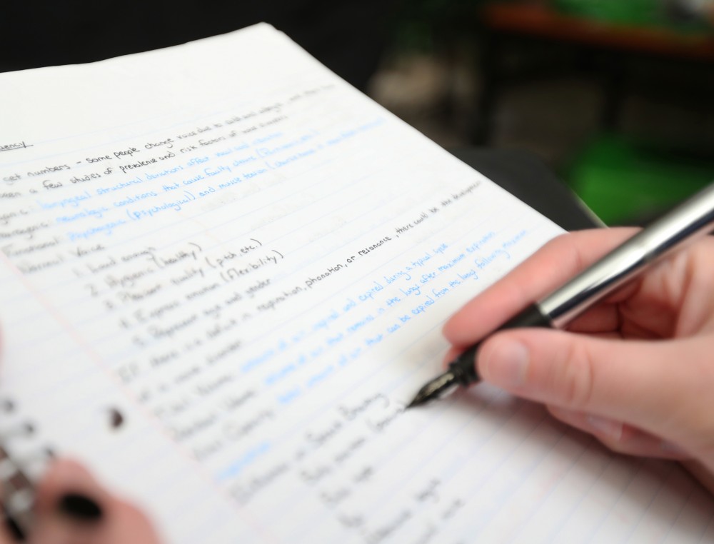 GVL/Kevin Sielaff - PHOTO ILLUSTRATION - Grand Valley State senior Renée Cameron revises a set of class notes on Sunday, Jan. 15, 2017.