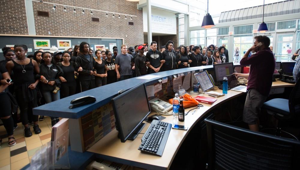 GVL/Kevin Sielaff - Demonstrators gather within the Kirkhof Center for ten minutes of silence. Grand Valley's NAACP chapter holds a campus wide demonstration in protest of police brutality Friday, Sept. 23, 2016 in Allendale.