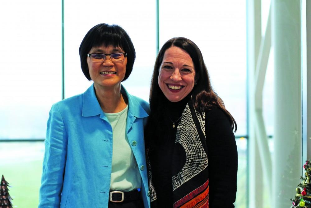 ​GVL/ Hannah Zajac- Susan Mendoza (left) and Sok Kean Khoo (right) pose for a photo inside the Mary Idema Pew Library on Tuesday, Feb. 7, 2017​.